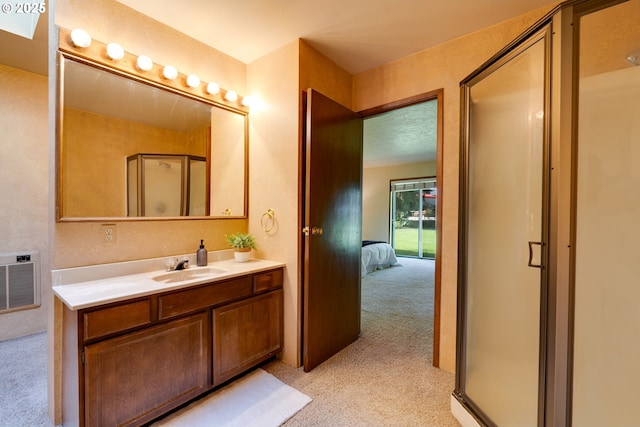 full bathroom featuring a stall shower, visible vents, connected bathroom, and vanity