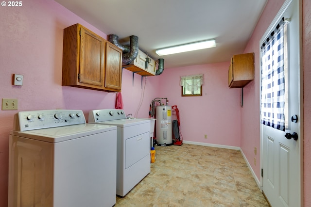 washroom with cabinet space, independent washer and dryer, baseboards, and water heater