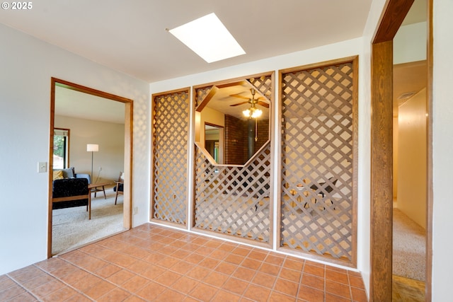 wine room featuring light carpet and light tile patterned floors