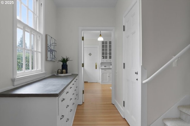 3707 SW 52nd Pl Unit 1, Portland, OR 97221 - hall featuring light wood finished floors and stairs