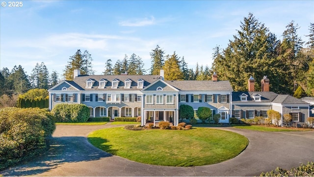 3707 SW 52nd Pl Unit 1, Portland, OR 97221 - colonial house featuring a front lawn, a chimney, and asphalt driveway