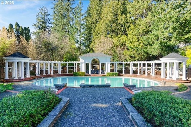 3707 SW 52nd Pl Unit 1, Portland, OR 97221 - swimming pool with a gazebo, a patio area, and view of wooded area
