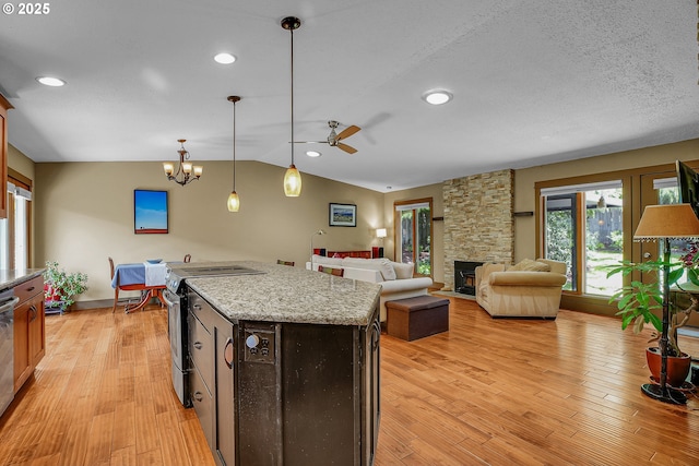 180 NW 107th Ave, Portland, OR 97229 - kitchen with appliances with stainless steel finishes, ceiling fan, light wood-type flooring, pendant lighting, and vaulted ceiling