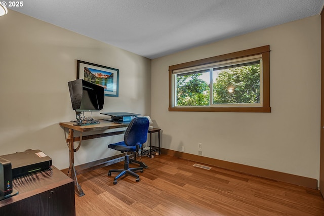 180 NW 107th Ave, Portland, OR 97229 - office space featuring light wood-style flooring and baseboards