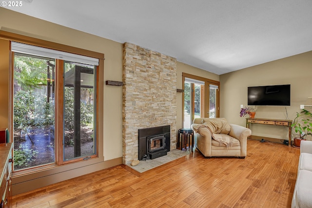 180 NW 107th Ave, Portland, OR 97229 - living area featuring light wood-type flooring and lofted ceiling