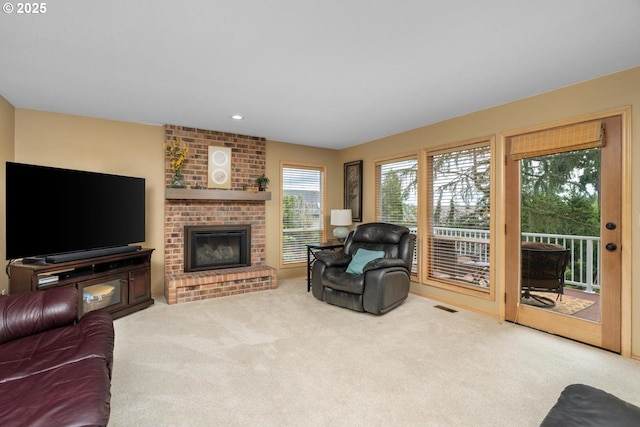 13910 SW Secretariet Ct, Beaverton, OR 97008 - carpeted living area featuring a brick fireplace and recessed lighting