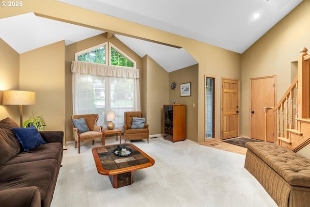 13910 SW Secretariet Ct, Beaverton, OR 97008 - carpeted living room with high vaulted ceiling, stairs, and baseboards