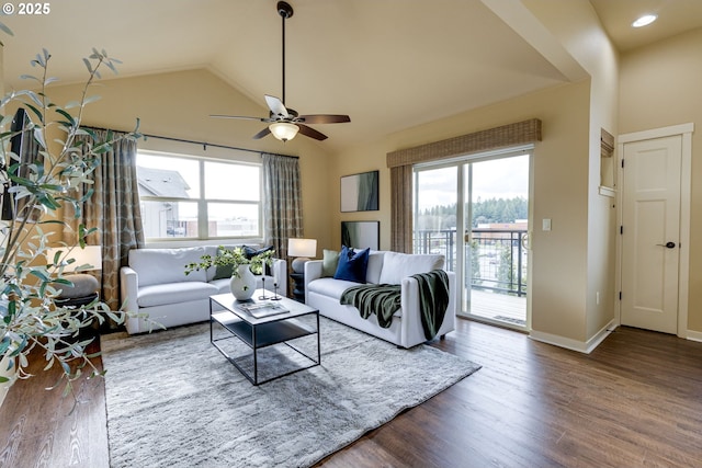 living room with lofted ceiling, ceiling fan, baseboards, and wood finished floors