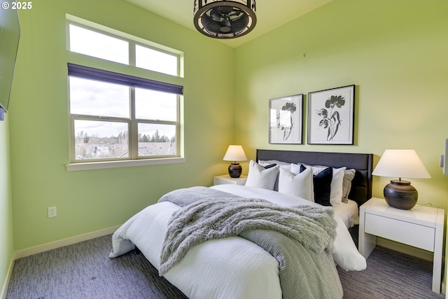 carpeted bedroom with baseboards