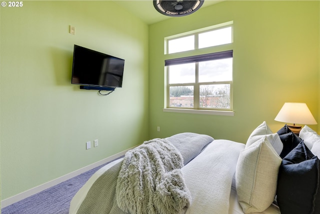 bedroom with carpet and baseboards