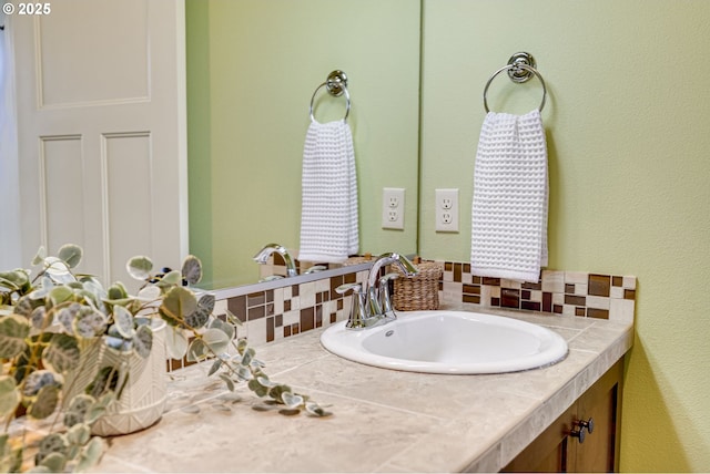 bathroom with decorative backsplash and vanity