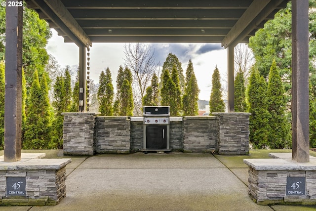 view of patio with exterior kitchen and grilling area