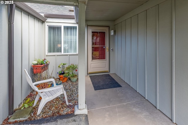 entrance to property featuring board and batten siding