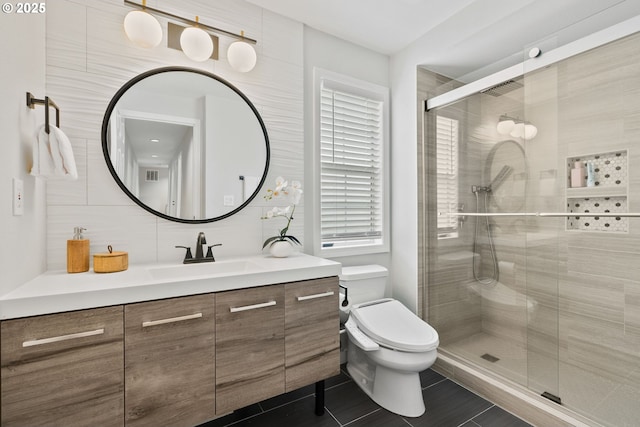 bathroom with a stall shower, decorative backsplash, toilet, tile patterned flooring, and vanity