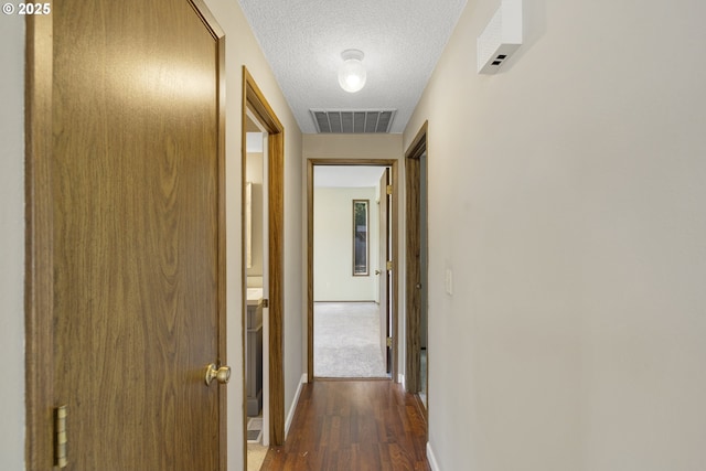 9115 NE Meadowbrook Cir, Vancouver, WA 98664 - hall with dark wood-style floors and a textured ceiling