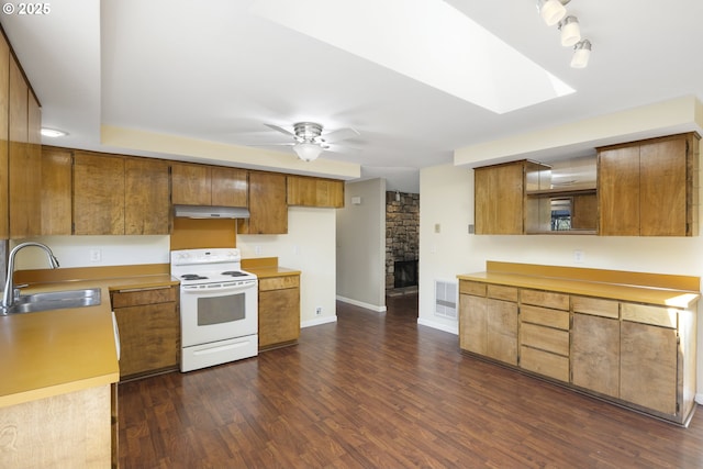 9115 NE Meadowbrook Cir, Vancouver, WA 98664 - kitchen featuring white electric range, brown cabinets, under cabinet range hood, and dark wood-style flooring