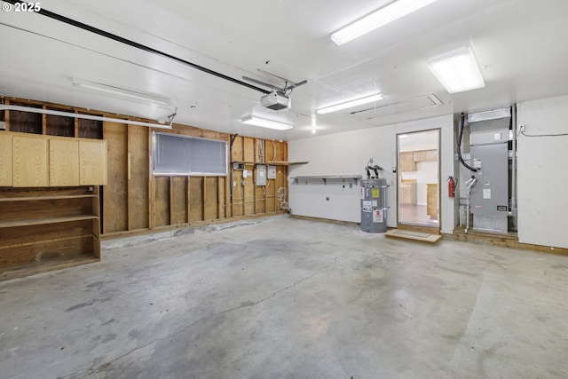 9115 NE Meadowbrook Cir, Vancouver, WA 98664 - garage featuring strapped water heater, heating unit, and a garage door opener