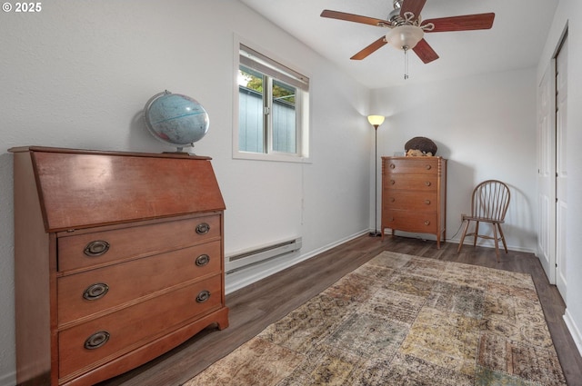 11144 NE Knott St, Portland, OR 97220 - bedroom featuring a baseboard radiator, dark wood-style flooring, and ceiling fan