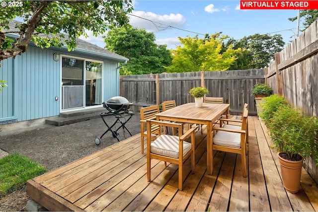 11144 NE Knott St, Portland, OR 97220 - deck featuring outdoor dining area, a fenced backyard, and a patio