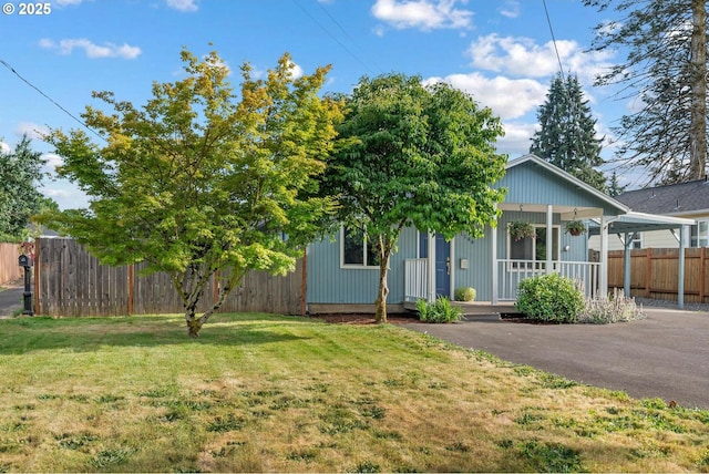 11144 NE Knott St, Portland, OR 97220 - view of property hidden behind natural elements with covered porch and driveway