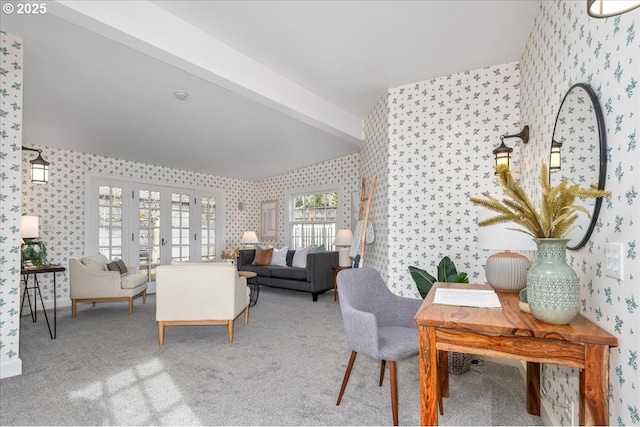 interior space featuring beamed ceiling, carpet floors, and french doors