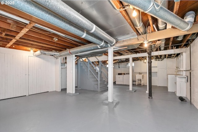 basement with washing machine and clothes dryer