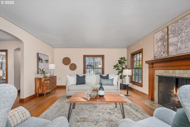 living room with a fireplace and light hardwood / wood-style floors