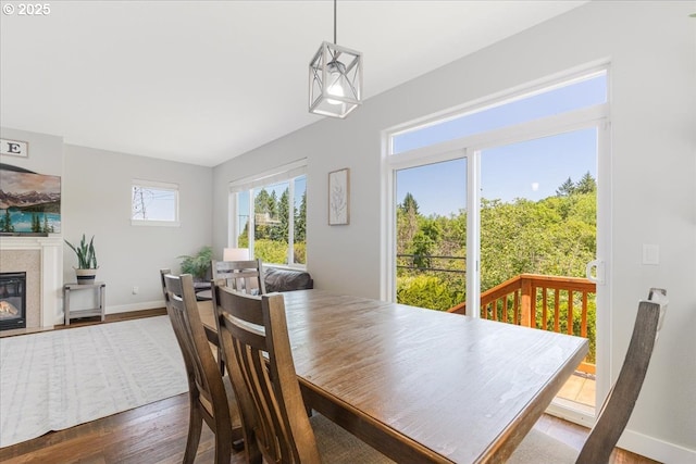 9050 SW 161st Ave, Beaverton, OR 97007 - dining room with wood finished floors, baseboards, and a high end fireplace