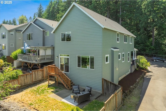 9050 SW 161st Ave, Beaverton, OR 97007 - back of property with a fenced backyard, a wooden deck, and a patio area