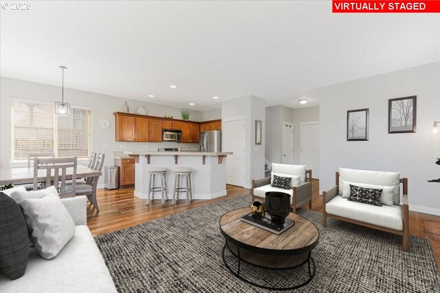 9050 SW 161st Ave, Beaverton, OR 97007 - living area with dark wood finished floors and recessed lighting