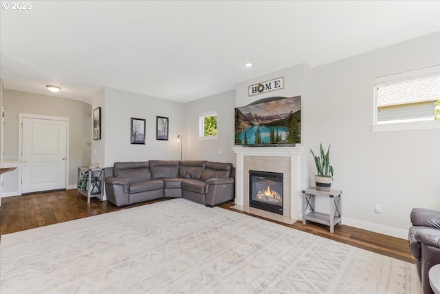 9050 SW 161st Ave, Beaverton, OR 97007 - living room with dark wood-type flooring, a fireplace, baseboards, and recessed lighting