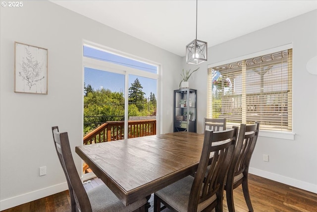 9050 SW 161st Ave, Beaverton, OR 97007 - dining space featuring baseboards, dark wood-style floors, and a chandelier