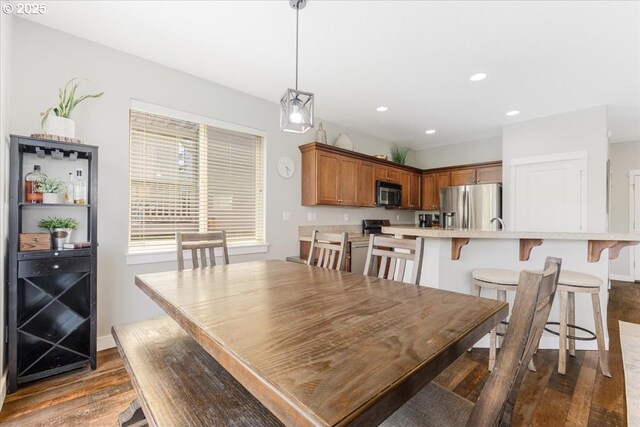 9050 SW 161st Ave, Beaverton, OR 97007 - dining area featuring baseboards and dark wood-type flooring