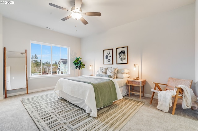 bedroom featuring baseboards, a ceiling fan, carpet flooring, and visible vents
