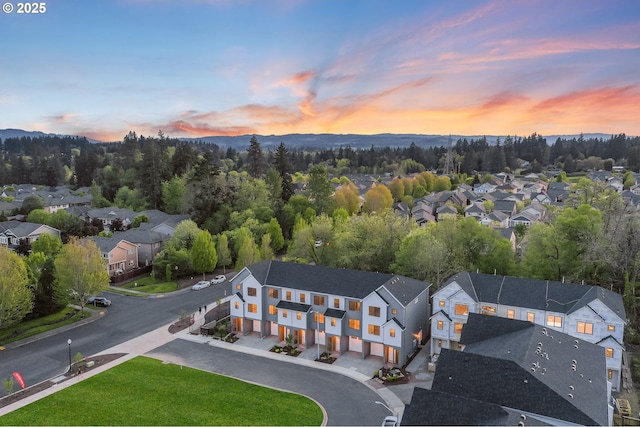 birds eye view of property with a mountain view and a residential view
