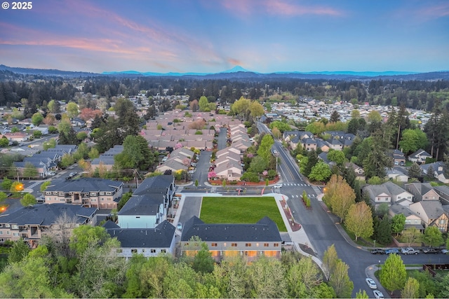 aerial view at dusk with a residential view and a mountain view