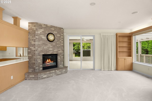 23705 SW Everest Ct, Sherwood, OR 97140 - unfurnished living room with carpet floors, a fireplace, and healthy amount of natural light