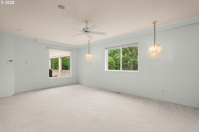 23705 SW Everest Ct, Sherwood, OR 97140 - carpeted spare room featuring crown molding, healthy amount of natural light, baseboards, a chandelier, and ceiling fan