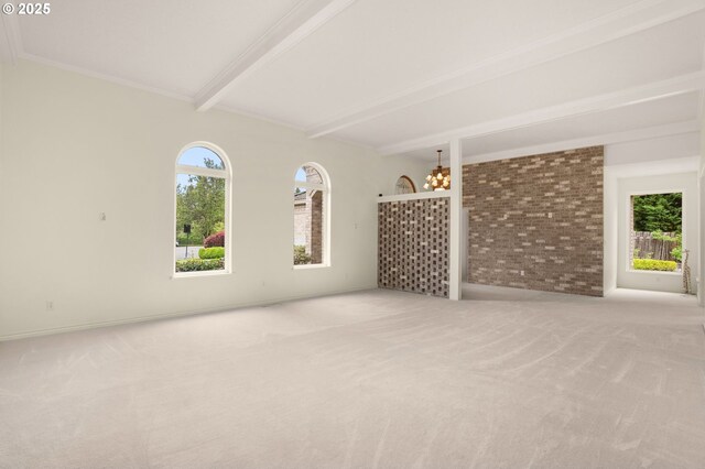 23705 SW Everest Ct, Sherwood, OR 97140 - unfurnished living room with beamed ceiling, a chandelier, carpet, brick wall, and ornamental molding