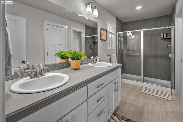 6510 N 89th Ave, Camas, WA 98607 - bathroom with double vanity, a stall shower, and recessed lighting
