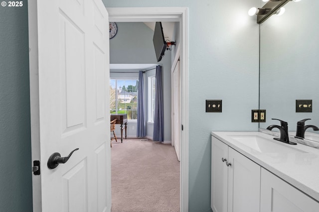 bathroom with baseboards and vanity