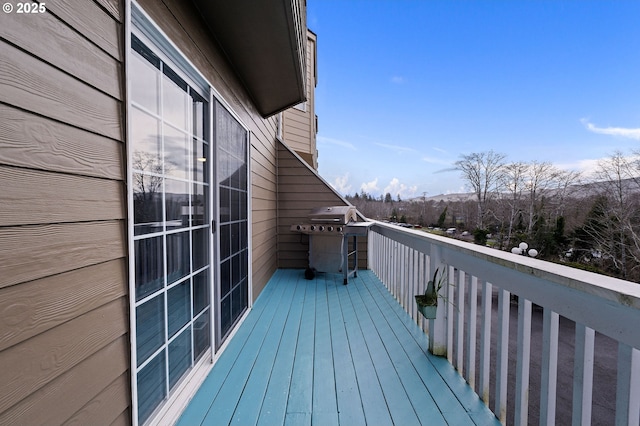 wooden deck with grilling area