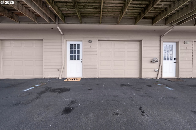 garage with aphalt driveway