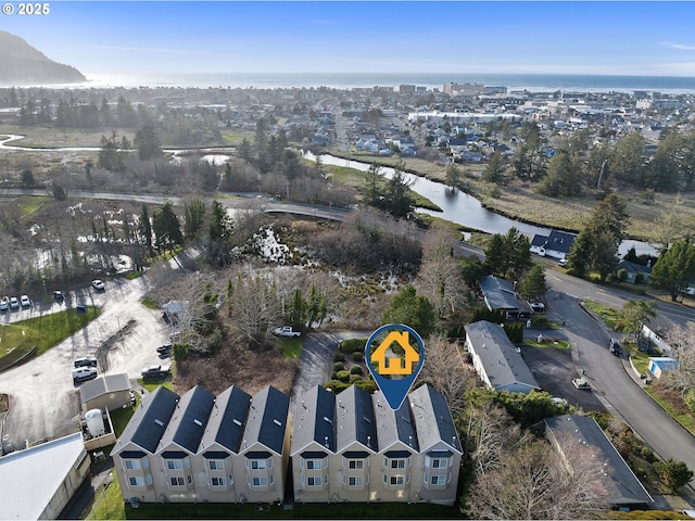 birds eye view of property featuring a water view