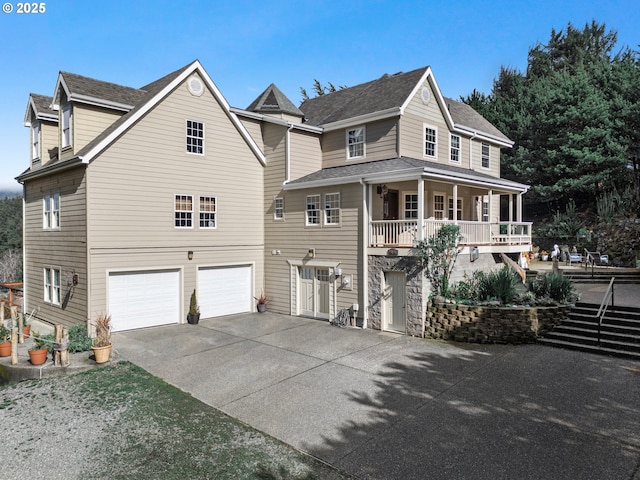 view of front of house featuring concrete driveway and a garage