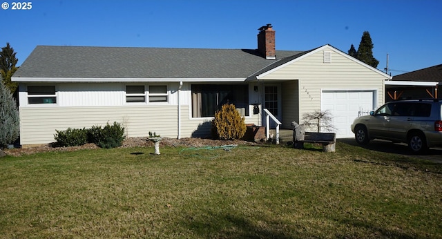 ranch-style house with a garage and a front lawn