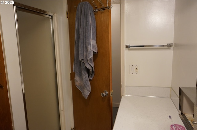 bathroom with a shower with shower door