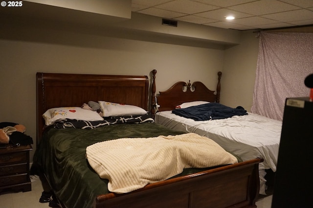 bedroom with a paneled ceiling