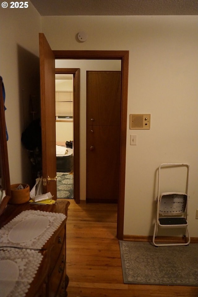 corridor featuring hardwood / wood-style floors