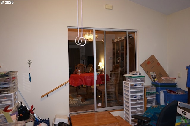 interior space with hardwood / wood-style flooring and a notable chandelier